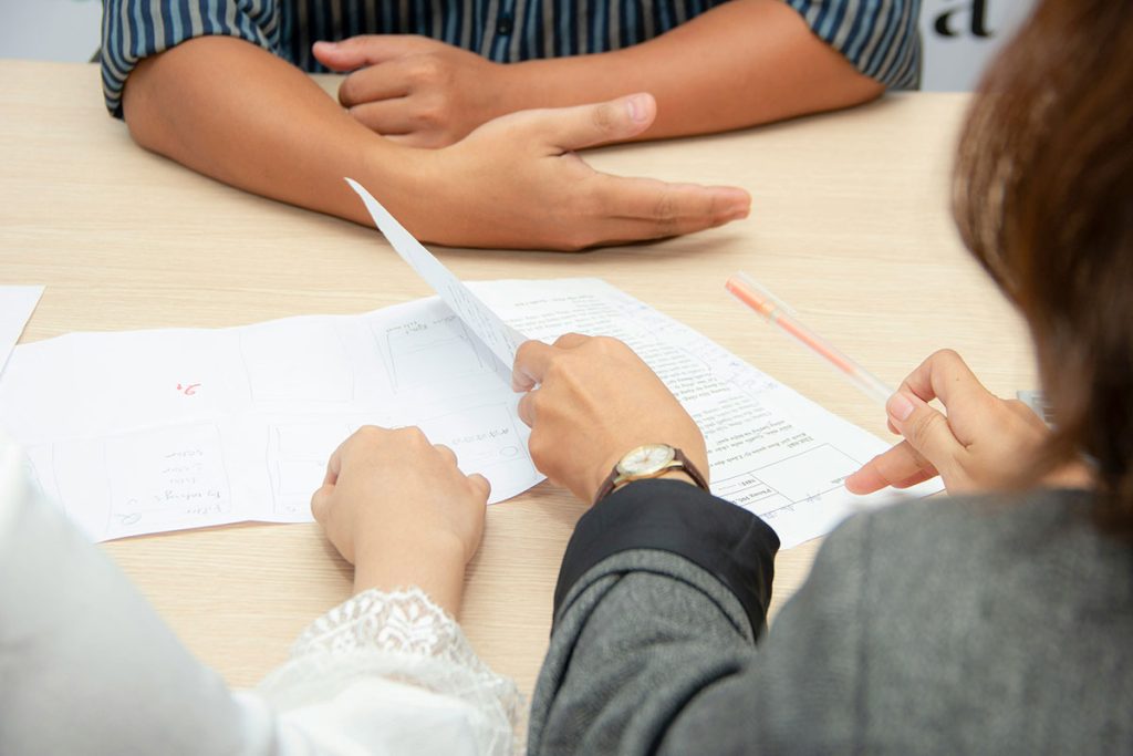 A lawyer helps people with paperwork.